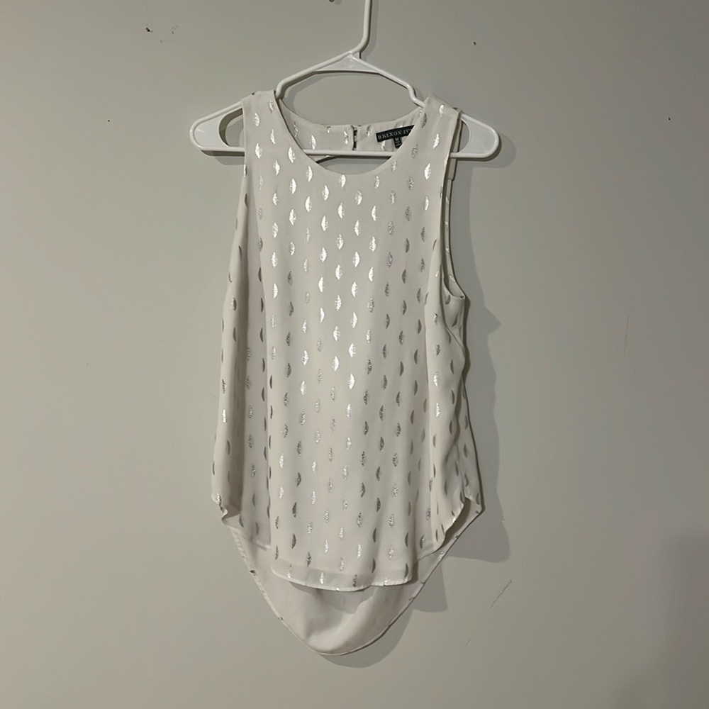 White tanktop with metallic silver detail and open back